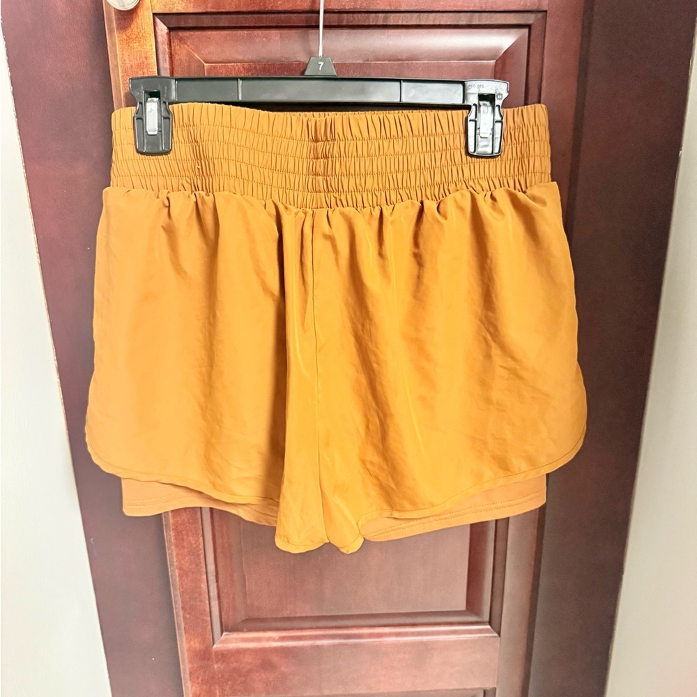 EUC FP Movement by Free People in the perfect fall shade of Orange, size M